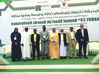 Tanzania Delegate with Mr. Omar Ansar, AAOIFI Secretary General (far left), King of Bahrain, Ibrahim Khalil (Middle with Bahrain Taditional dress, Dr. Bello Lawal Danbatta, and former Secretary General for IFSB (with Nigerian Traditional dress)