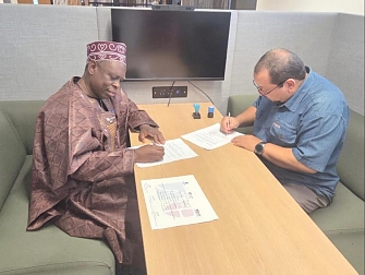 CIFCA Secretary General, Mr. Salum Lupande and Professor Hasan Lahsane, at a side meeting at Durham University in UK, signing a Memorandum of Association for Collaboration.